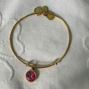 alex and Ani gold with pink gem charm
